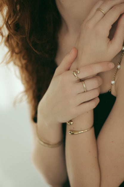 gold jewelry. gold ring. gold bracelet. ring stack. bracelet stack