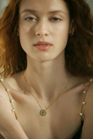 Foiled lightning bolt pendant with diamond stars on a 14k gold cable chain