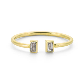 Delicate gold ring with 2 baguette diamonds
