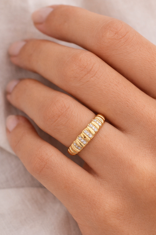 Sculptural croissant diamond ring in 14k gold stacked on finger